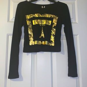 A gold and black Paris long sleeved shirt